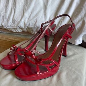 Red patent leather strapped heels